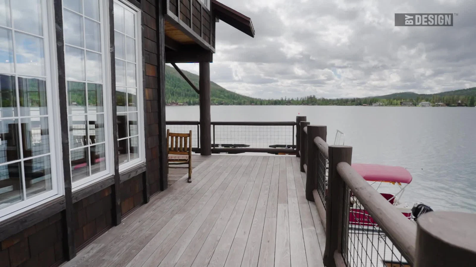 Grand Lake Yacht Club’s wood deck and railing overlooking Grand Lake and the surrounding hills